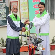 Mr.Agha Ahmad Raza (GMO) handing over Motor Bike key to Employee.